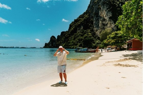 Old man walking along the beach